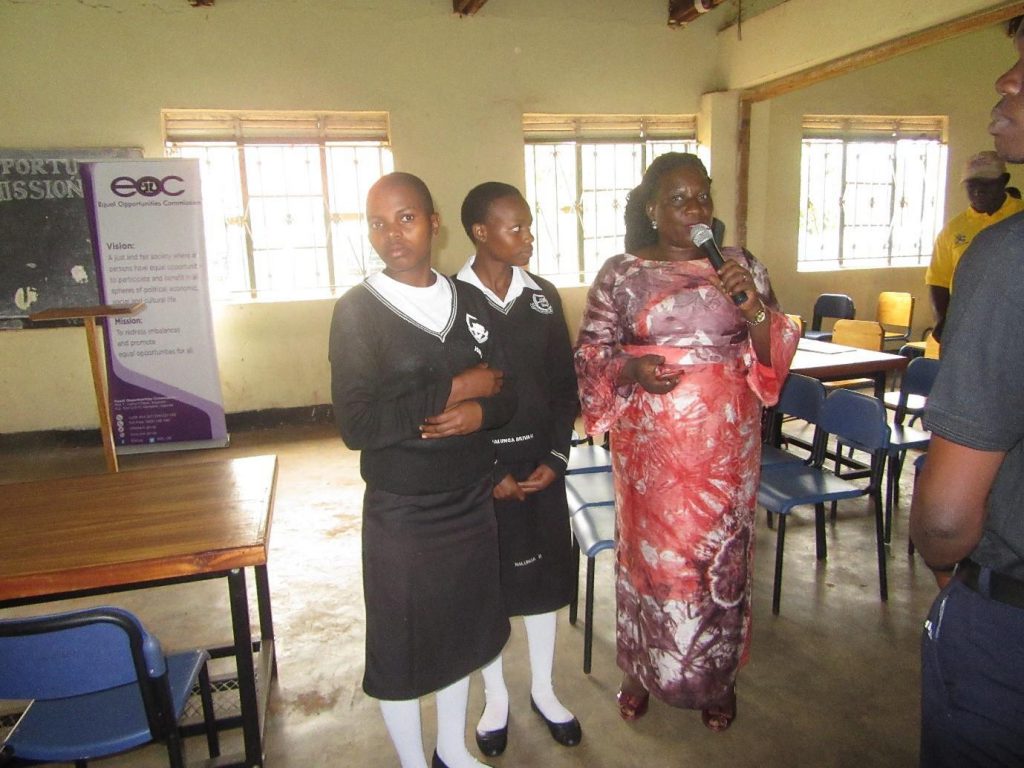 The Principal Education Officer, Petua Babirye Isabirye giving her remarks